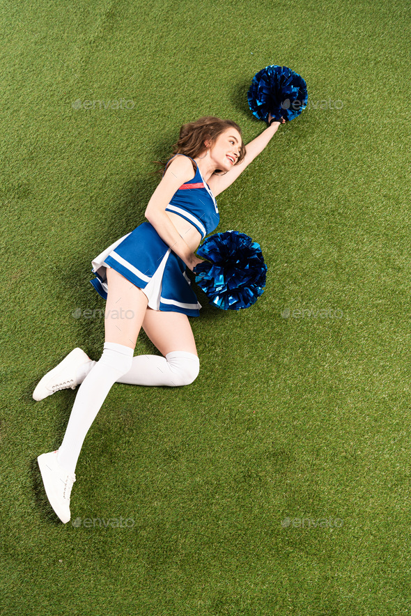 Sexy Cheerleader Girl In Blue Uniform Standing With Soda And Pompom On  Green Field Isolated On White Stock Photo, Picture and Royalty Free Image.  Image 128150236.