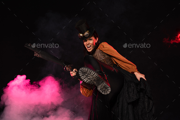 aggressive steampunk woman in top hat holding gun in pink smoke on black
