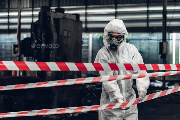 Scientist wear Chemical protection suit check danger chemical