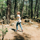 Tourist school boy kid child in a casual clothing walking in the summer greenwood leaf forest with - PhotoDune Item for Sale