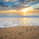 Sand and rocks on seashore at sunset - PhotoDune Item for Sale