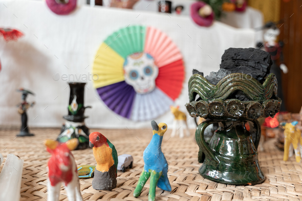 A ceramic copal globet is decorating a Day of the Dead sleeping mat