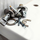 faulty ball valve and fixtures lie on edge of sink - PhotoDune Item for Sale
