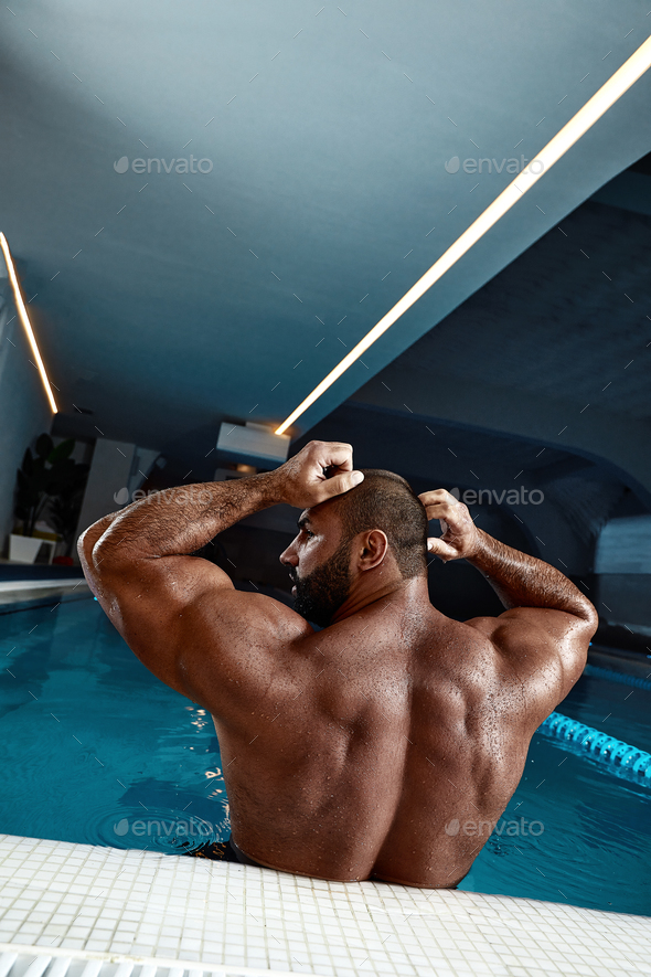 Fashion Portrait Of A Very Muscular Sexy Man In Underwear At Swimming Pool  Stock Photo by Gerain0812