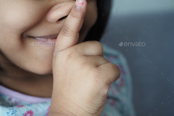  kid raising her hand indicating to stop talking or to be silent