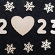 New Year&#39;s card 2023. Wooden numbers of the year, heart shape and snowflakes on a shiny black - PhotoDune Item for Sale