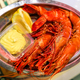 Jumbo shrimps with lemon and sauce on metal plate - PhotoDune Item for Sale