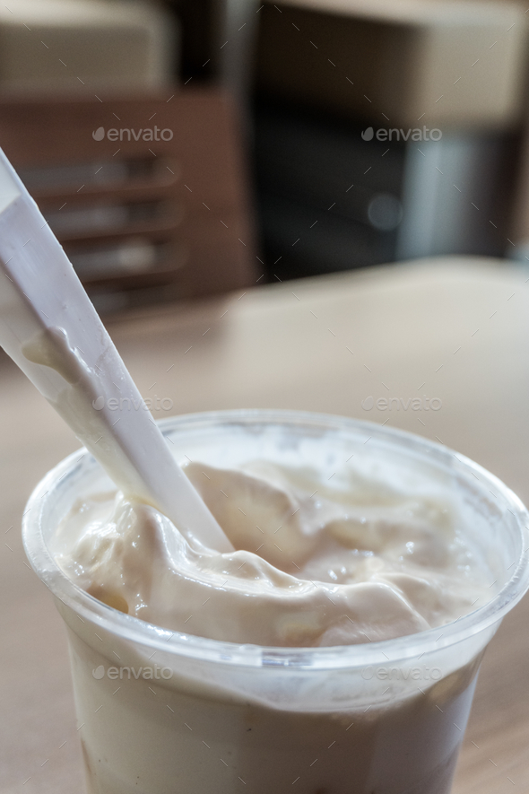 coffee foam in a disposable cup Stock Photo