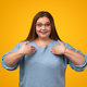Cheerful plump woman pointing at herself - PhotoDune Item for Sale