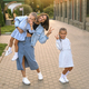 A mother and daughters show a hand gesture and laugh merrily - PhotoDune Item for Sale