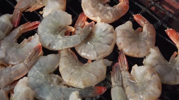 Panorama of the Large Raw King Prawns Roasting on the Grill Grid alt