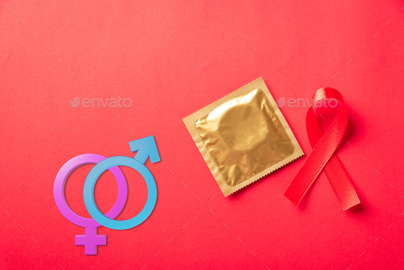 Red Bow Ribbon Symbol Hiv Aids Cancer Awareness Condom With Shadows And Male Female Gender 0974