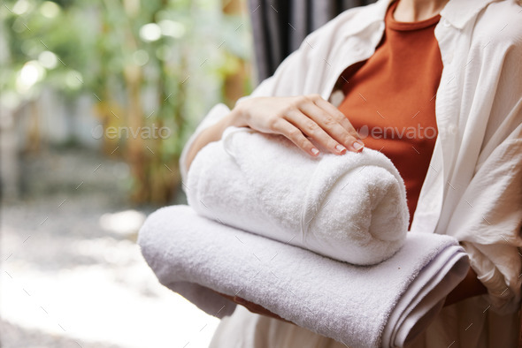 Laundry woman towel clean hotel stacked folded