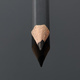 Closeup of black pencil with reflection on black acrylic board - PhotoDune Item for Sale