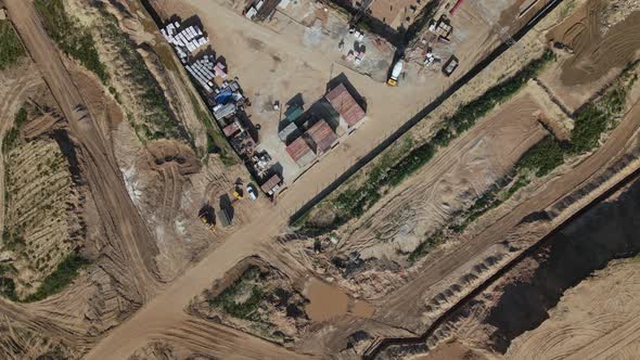 Construction site for a new city block. Construction work is underway. alt