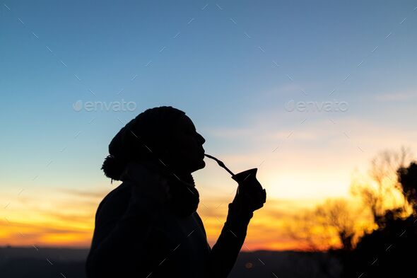 Close Up Of Smiling Friends Drinking Yerba Mate Using A Thermos With Hot  Water In The Countryside At Sunset Stock Photo - Download Image Now - iStock