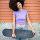 Smiling black young woman with skateboard - PhotoDune Item for Sale