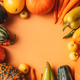 Autumn harvest of ripe vegetables on an orange background with an empty space in the center - PhotoDune Item for Sale