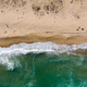 Aerial View of Ocean Waves Washing a Secluded Sandy Shoreline - PhotoDune Item for Sale