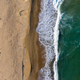Aerial View of Ocean Waves Washing a Secluded Sandy Shoreline  - PhotoDune Item for Sale
