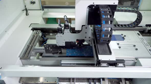 The Engineer Works for the Surface Mount Technology Machine alt