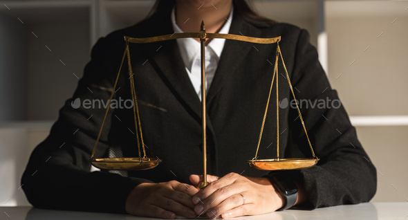Concept of justice and law, female lawyer in office with brass degree.
