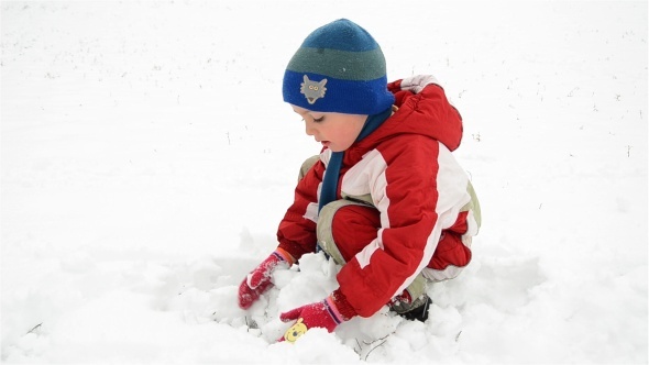 Boy Playing With Snow 1