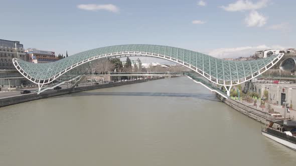 Tbilisi, Georgia - April 2 2021: Aerial view of Tbilisi city central park and Bridge of Peace. alt