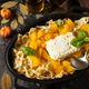 Feta pasta recipe made of pumpkins, feta cheese, garlic and herbs on dark stone background.   - PhotoDune Item for Sale