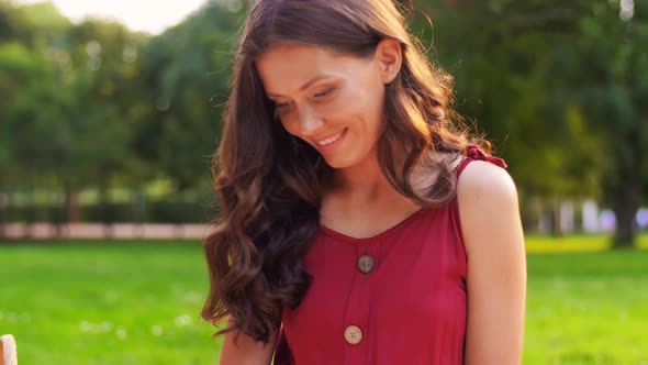 Happy Woman Reading Book at Picnic in Summer Park alt