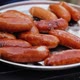 Ready for eat grilled sausages on the big pan or steel plate. Barbecue grill outdoors. BBQ - VideoHive Item for Sale