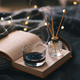 Cozy home atmosphere with candle and book in bed - PhotoDune Item for Sale