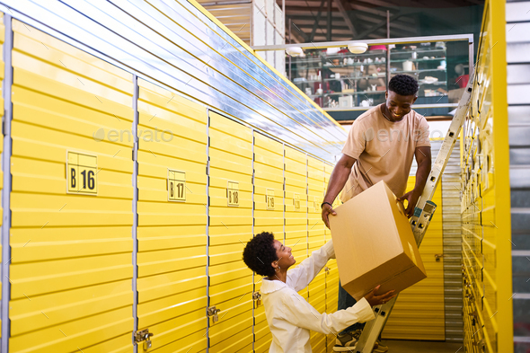 Young woman gives her boyfriend a cardboard box with things Stock Photo ...