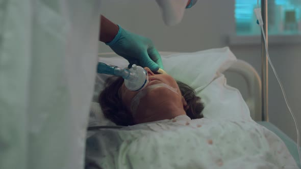 Ill Patient Breathing Oxygen Mask Hospital Bed alt