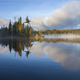 Small island with trees on a foggy northern Minnesota lake at sunrise in September - PhotoDune Item for Sale