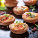 Homemade mini tart with tomatoes and cheese. Vegetarian party food. - PhotoDune Item for Sale