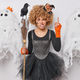 Halloween celebration. Studio shot of young angry African american lady wearing costume of witch - PhotoDune Item for Sale