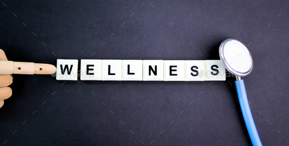 stethoscope and alphabet letters with the word wellness. Stock Photo by ...