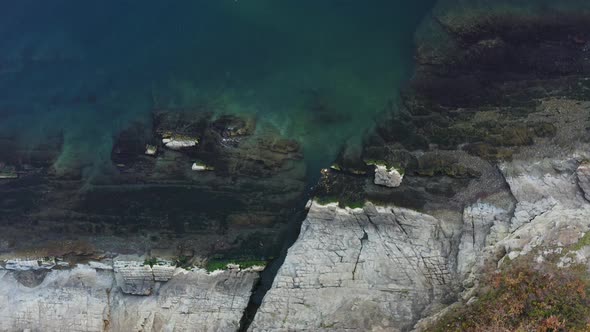 View From the Drone Vertically Down to the Ocean in Calm Weather alt