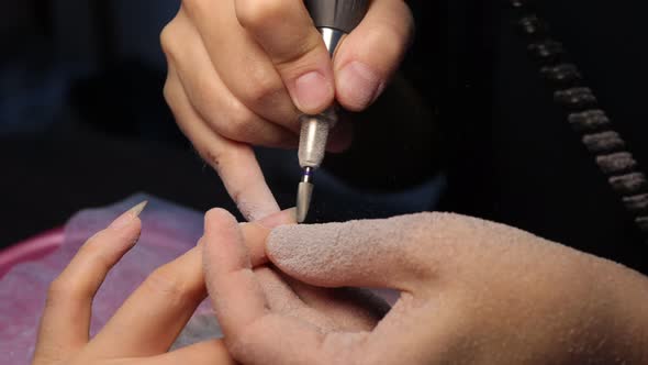 Anonymous Beautician Doing Manicure to Female Client