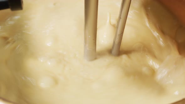 Mixing ingredients for chocolate fudge at candy factory