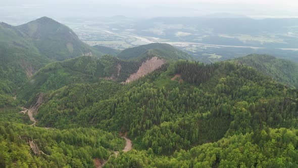 Flying over the rocky mountains with larches alt