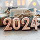 Christmas and New Year card. Number 2024 on holiday background. Christmas lights bokeh background.  - PhotoDune Item for Sale