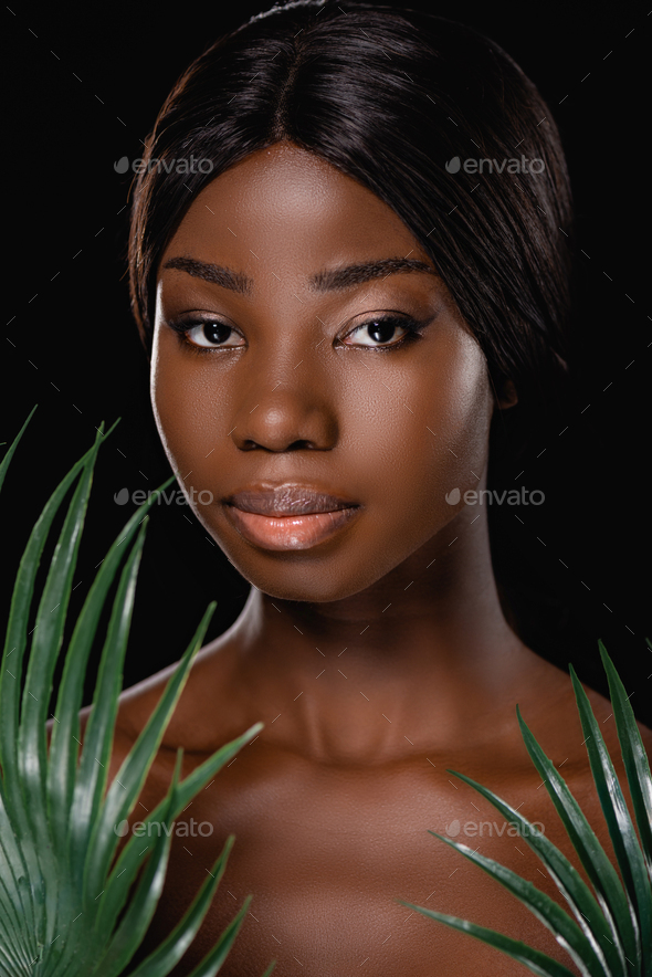 African American Naked Woman Near Green Palm Leaves Isolated On Black Stock Photo By