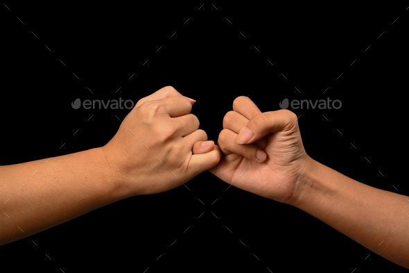 Two hands hook each other's little finger concept of promise Stock
