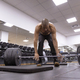 Low angle view of a man deadlifting in a gym - PhotoDune Item for Sale