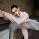 Flexible girl ballerina doing stretching exercise at dance studio - PhotoDune Item for Sale