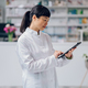 Japanese health worker is standing in a pharmacy - PhotoDune Item for Sale