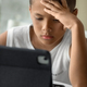 Preteen student boy using laptop at the table during online webinar, distance learning concept - PhotoDune Item for Sale