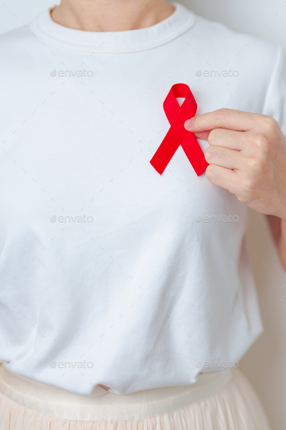 Burgundy ribbon in lady hands, multiple myeloma syndrome awareness,  healthcare Stock Photo